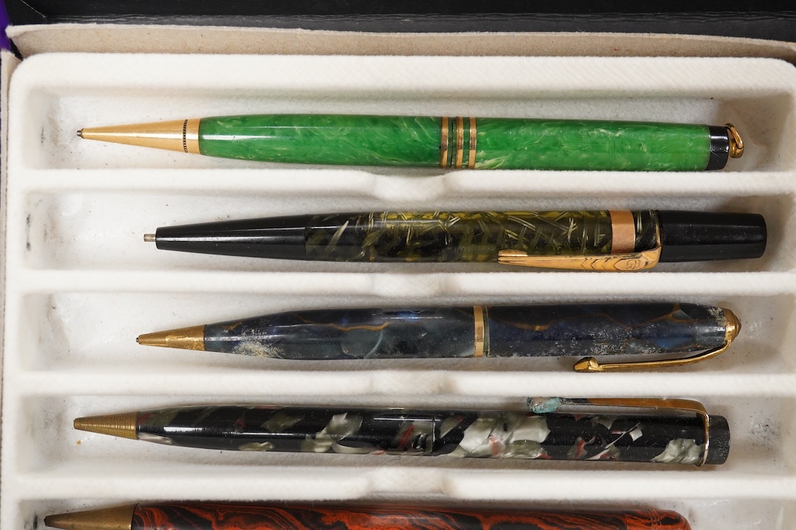 A collection of vintage pencils including an early enamel example